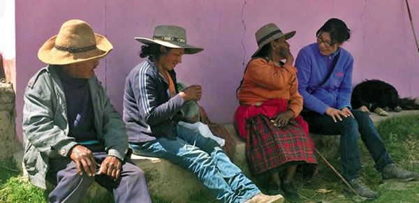 Sr. Savina (far right) ministers to the elderly in Peru.